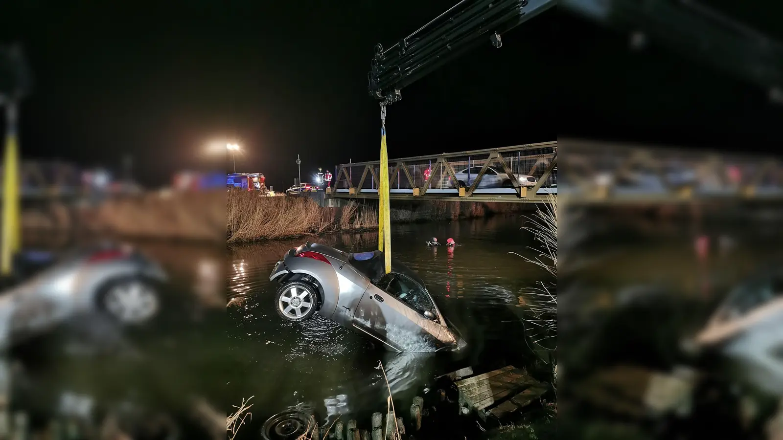 Taucher im Einsatz - das versunkenen Auto wird mit einem Kran geborgen. (Foto: Feuerwehr Emden/dpa)