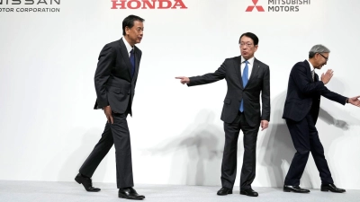 Nissan und Honda führen Fusionsgespräche und wollen Mitsubishi Motors daran beteiligen. (Foto: Eugene Hoshiko/AP/dpa)