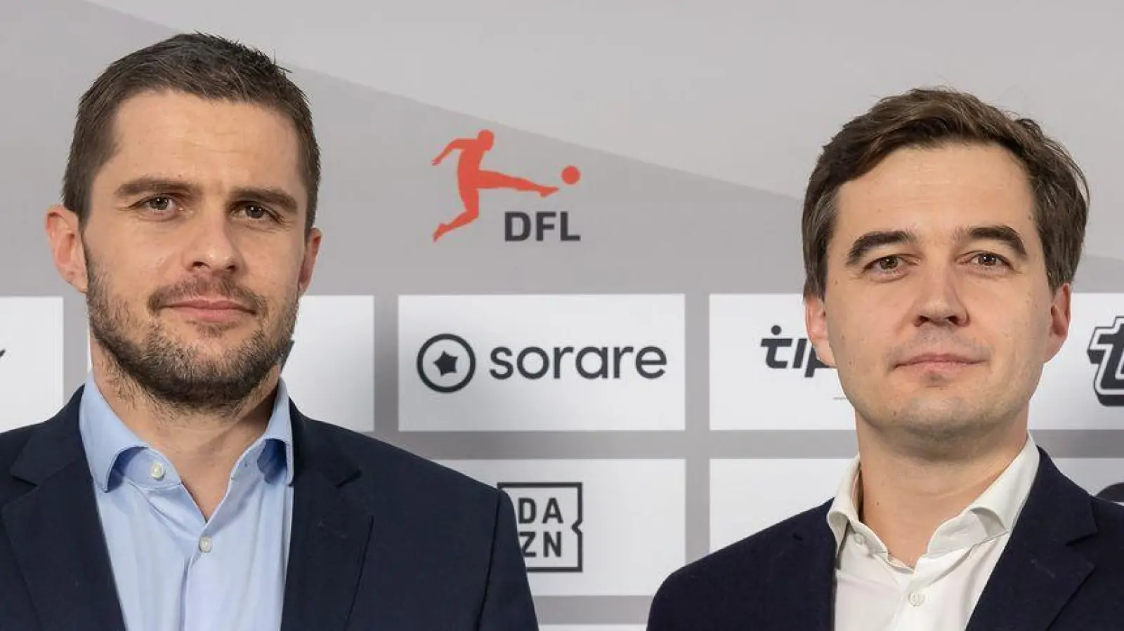 Steuern den deutschen Fußball: Lenz und Merkel. (Foto: Jürgen Kessler/dpa)