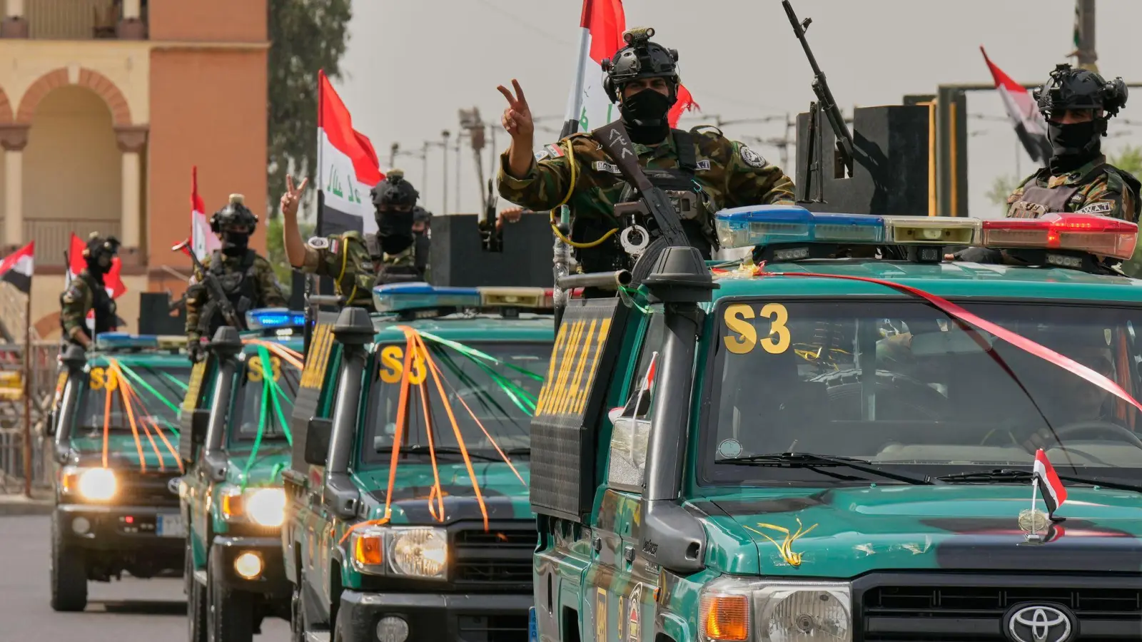 Im Irak wird der US-Truppenabzug als „Tag der Unabhängigkeit“ gefeiert. (Foto: Hadi Mizban/AP/dpa)